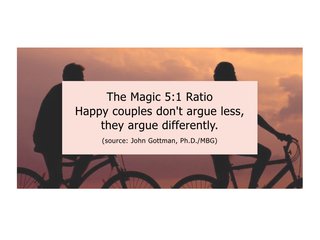 Two people ride a bike at sunset