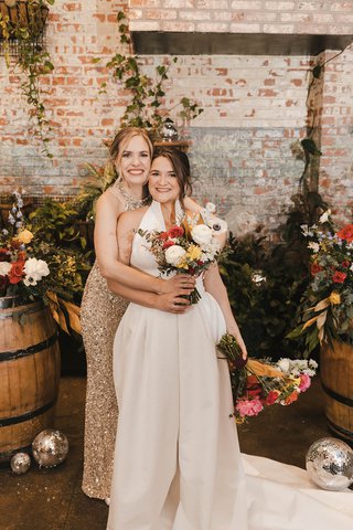 two brides holding flowers