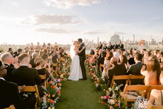 two people kissing at their wedding ceremony