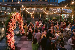 a party with a flower arch