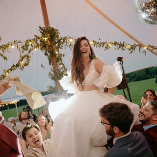 woman in chair during horah
