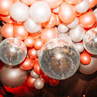 Pink and silver balloons and disco balls