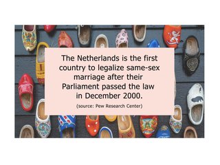 A pile of wooden clogs with text on top